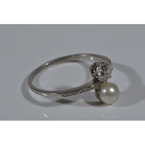 85 - Antique  diamond (.33ct) & pearl ring with channel set diamond shoulders on white metal which te... 