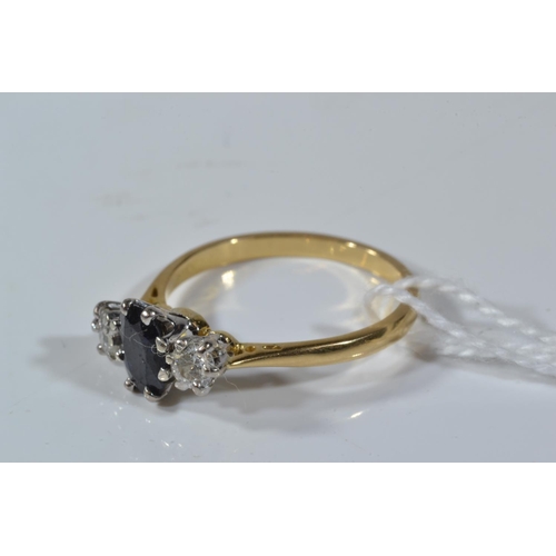 100 - 18ct gold, sapphire & diamond three stone ring, size M, 2.61 grams, scratch to sapphire