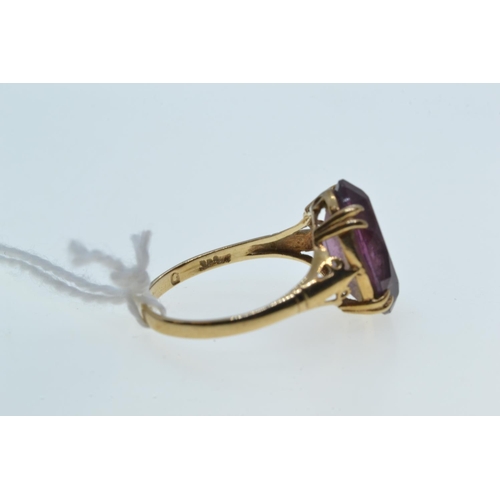 113 - 9ct gold & purple stone ring, size O, 2.4 grams