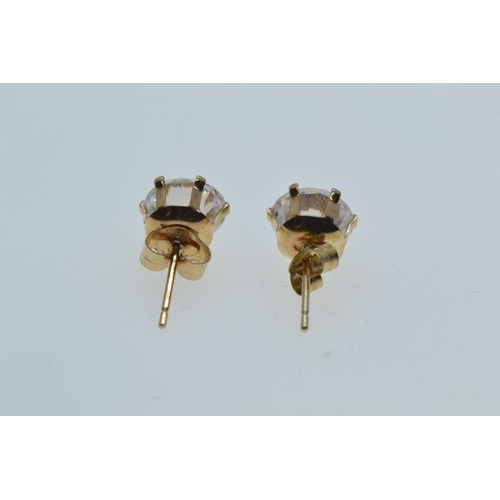 119 - Pair of 9ct gold & white stone ear studs, gross weight 0.92 gram