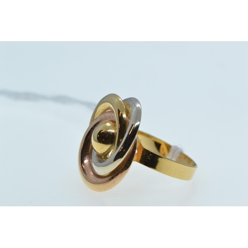 123 - 18ct tri-colour gold ring, of foliate design, size P, 4.25 grams