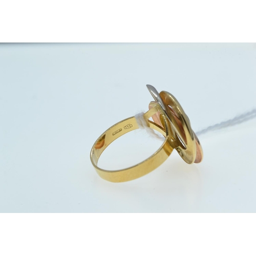 123 - 18ct tri-colour gold ring, of foliate design, size P, 4.25 grams