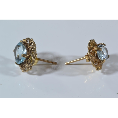 164 - Pair of 14ct gold & diamond ear studs, 1 gram, & a pair of 9ct gold & blue stone ear stu... 