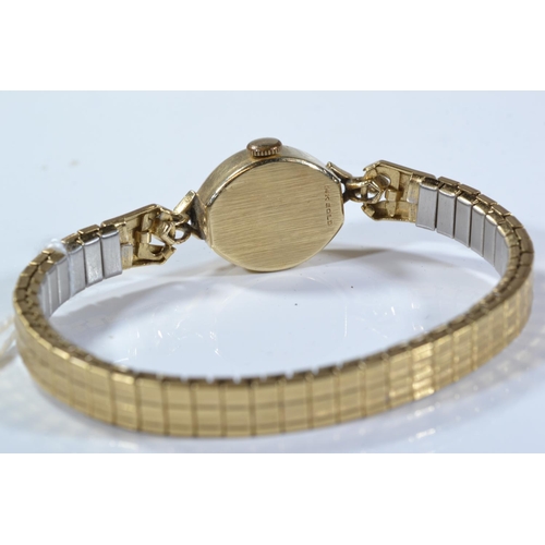 169 - Simon 14ct gold cased ladies watch, case width 15mm, with later stretched metal link bracelet