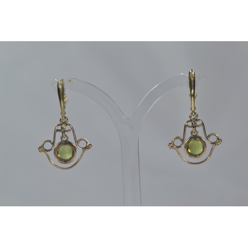 170 - Pair of 9ct gold & green stone pendant earrings, length 35mm, gross weight 3.44 grams