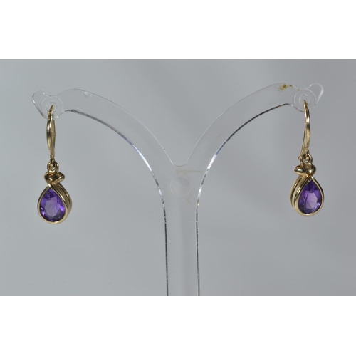 175 - Two pairs of 9ct gold & gem set pendant earrings, set with amethyst & blue stone respectivel... 