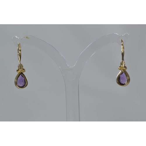 175 - Two pairs of 9ct gold & gem set pendant earrings, set with amethyst & blue stone respectivel... 