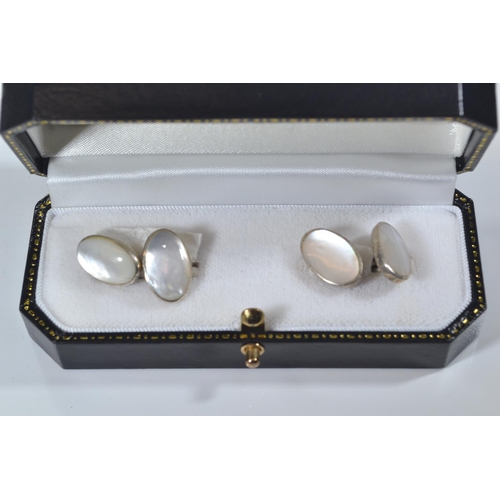 189 - Nine pairs of silver cufflinks