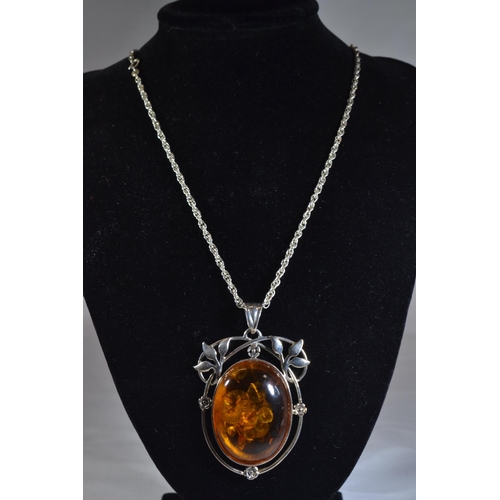 194 - Silver & amber pendant & chain, pendant length including bale 67mm, chain circumference 505m... 