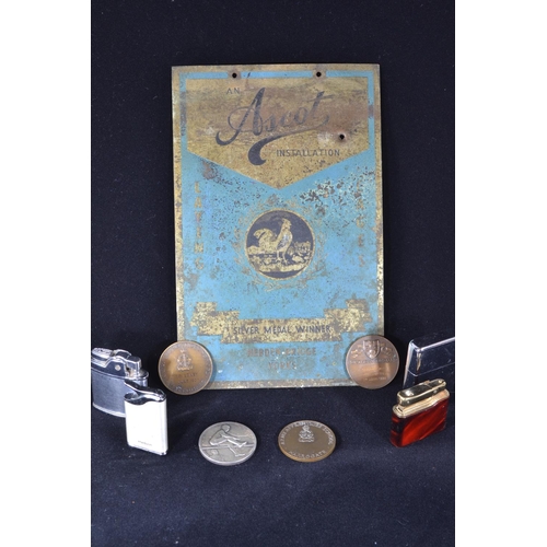 217 - 'Ascot Installation' silver medal winner enamel sign, four cigarette lighters & various medallio... 