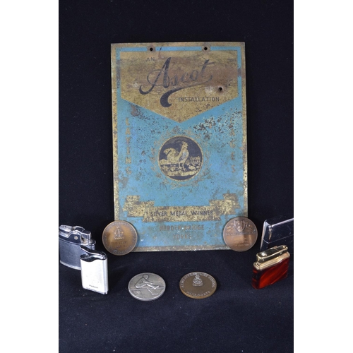 217 - 'Ascot Installation' silver medal winner enamel sign, four cigarette lighters & various medallio... 