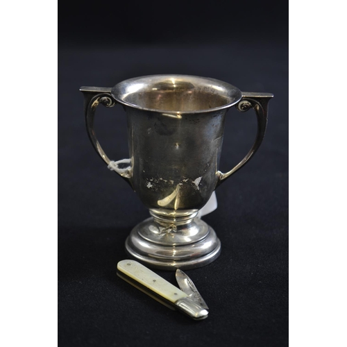 222 - Small silver twin handled cup, maker WN Ltd, Birmingham 1921, 70.1 grams, together with a HM silver ... 