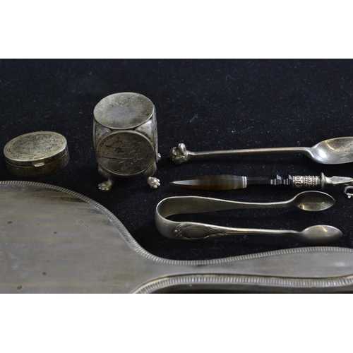 246 - Various silver items including vanity mirror, sugar nips, dog finial spoon, pill box, three brooches... 