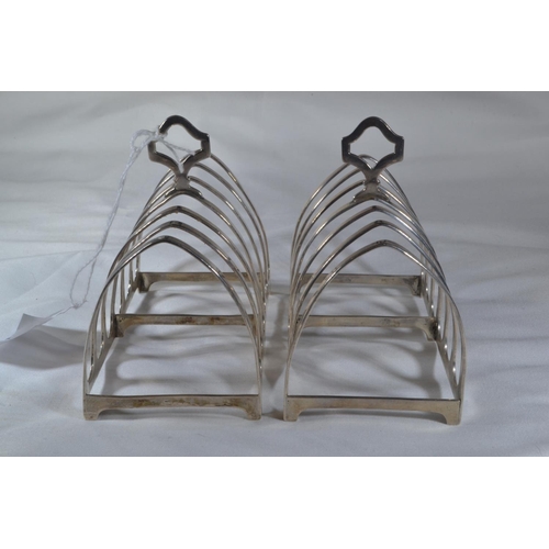 259 - Pair of silver toast racks, maker OT & BD, London 1925 & 1927 respectively, width 11.2cm, gr... 