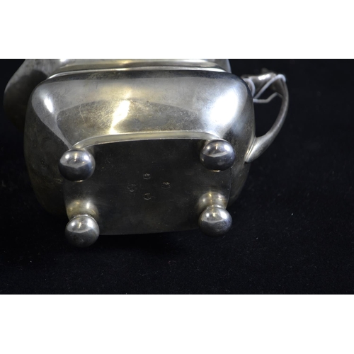 261 - Silver milk jug, maker's mark rubbed, Sheffield 1961, 15cm wide, 268 grams