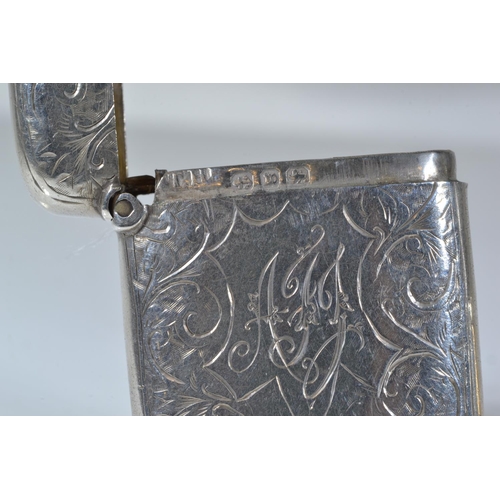 268 - Two silver vesta cases, one initialled maker TH, Birmingham 1896, the other with a figure of a golfe... 