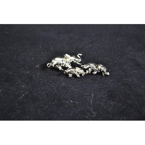 272 - Silver set of three miniature graduated elephants, maker MH, Sheffield 2001, largest 4.2cm wide... 