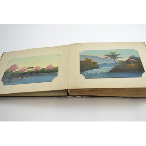 420 - Early C20th Japanese lacquered album containing postcards of Japan, inc. silk printed and hand paint... 