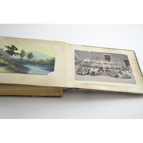 420 - Early C20th Japanese lacquered album containing postcards of Japan, inc. silk printed and hand paint... 