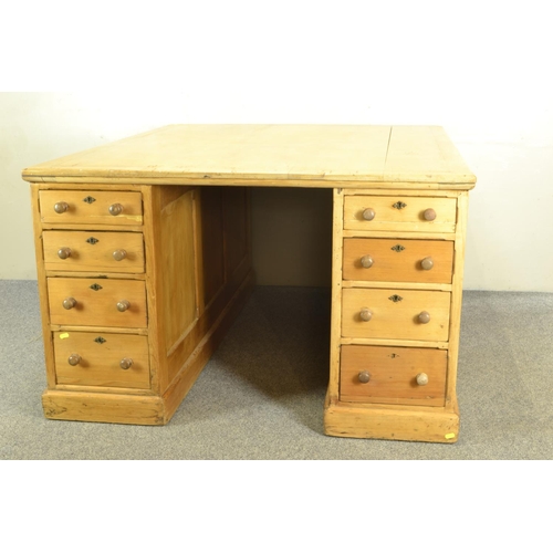 456 - Early C20 pine partners desk. With 8 drawers to each side, and side cabinet. w121cm L152cm h76cm