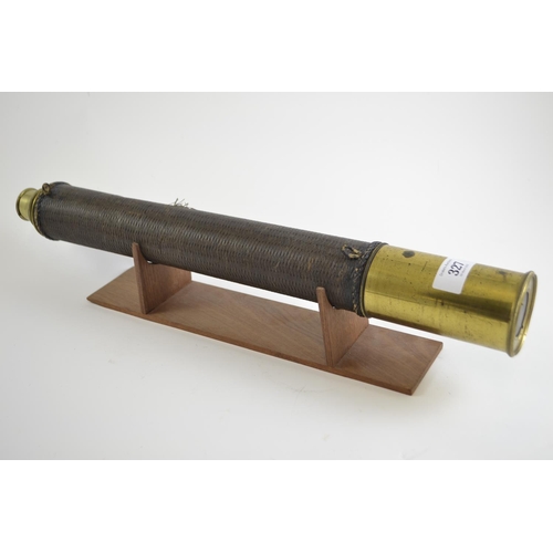 327 - Brass telescope on wooden stand. 