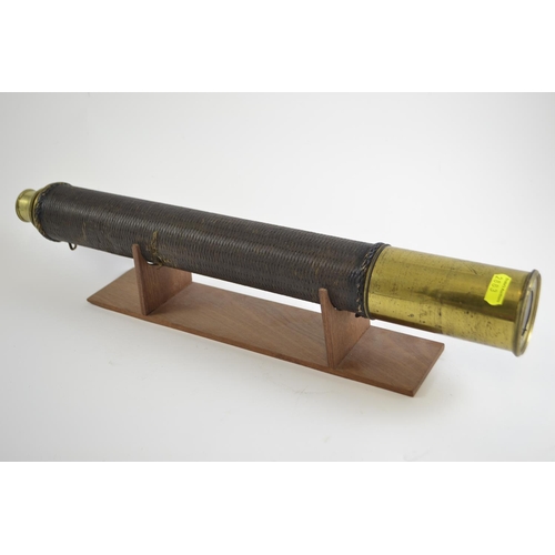 327 - Brass telescope on wooden stand. 