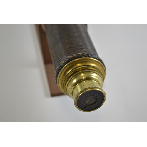 327 - Brass telescope on wooden stand. 