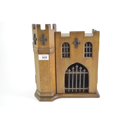 409 - Unusual castle smokers cabinet. Reg No. 18593235. Width 27cm x height 30cm x depth 18cm.