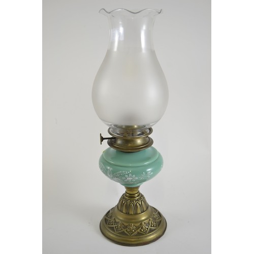 407 - Art Nouveau lamp with green glass reservoir and brass base.