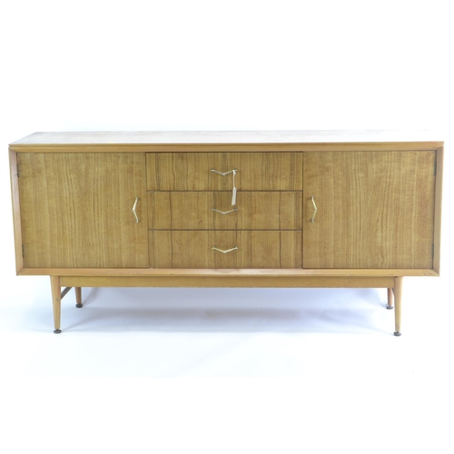 463 - A teak mid-century sideboard by CWS. Comprised of 3 central drawers inc. cutlery drawer, flanked by ... 