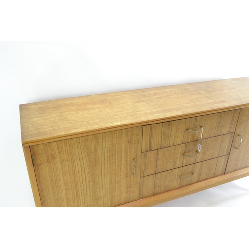 463 - A teak mid-century sideboard by CWS. Comprised of 3 central drawers inc. cutlery drawer, flanked by ... 