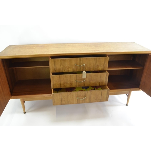 463 - A teak mid-century sideboard by CWS. Comprised of 3 central drawers inc. cutlery drawer, flanked by ... 