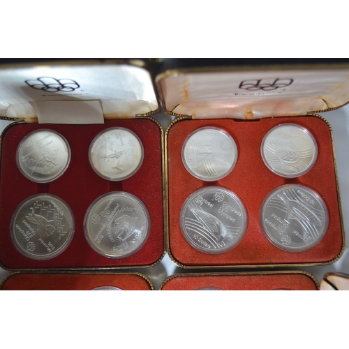 299 - Canadian Olympic coin proof sets, 1972, cased, inc. Series IV, V, VI and VII