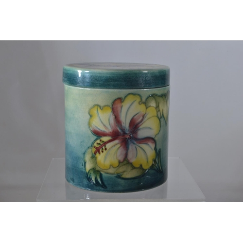 351 - Moorcroft 'Hibiscus' pattern cylindrical pot & cover, impressed mark & paper label to unders... 