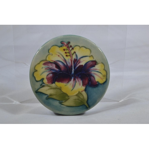 351 - Moorcroft 'Hibiscus' pattern cylindrical pot & cover, impressed mark & paper label to unders... 