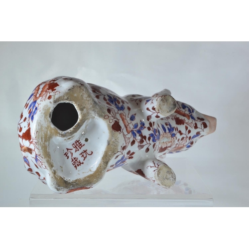 353 - Japanese imari pig figure, possibly Aritaware, 20th century, character marks to underside, length 17... 