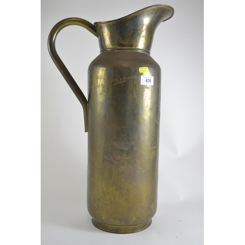 426 - Large metal ewer. 57cm high.