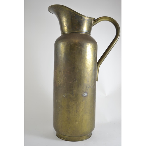 426 - Large metal ewer. 57cm high.