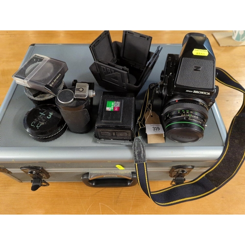 319 - Zenza Bronica ETRS in case with 2 x film backs,  75mm lens and accessories Inc filters Etc