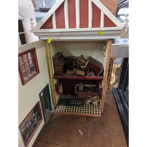 371 - Shop front dolls house.