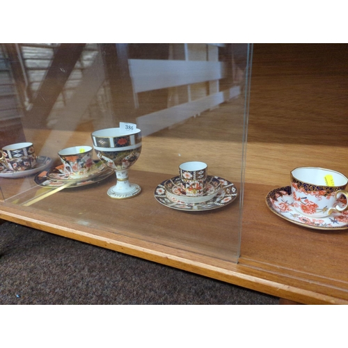 386 - Royal Crown Derby imari pattern pieces, including a goblet dated 1975, 12.3cm high, a trio dated 191... 