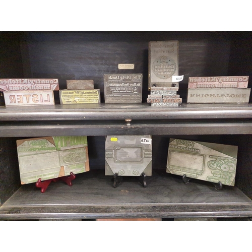 650 - Large selection of advertising printing blocks over two shelves