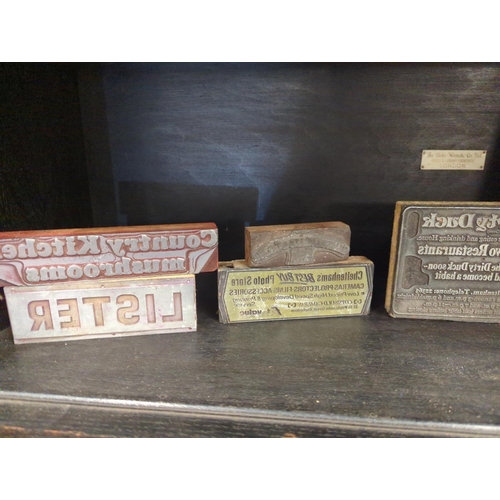 650 - Large selection of advertising printing blocks over two shelves