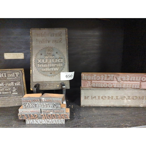 650 - Large selection of advertising printing blocks over two shelves