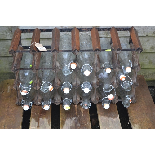 227 - 16 re-sealable bottles in rack