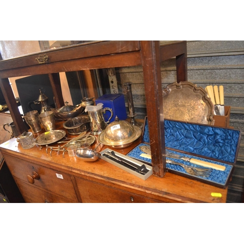 385 - Quantity of silver plated ware, inc. candlesticks, gravy boat etc.