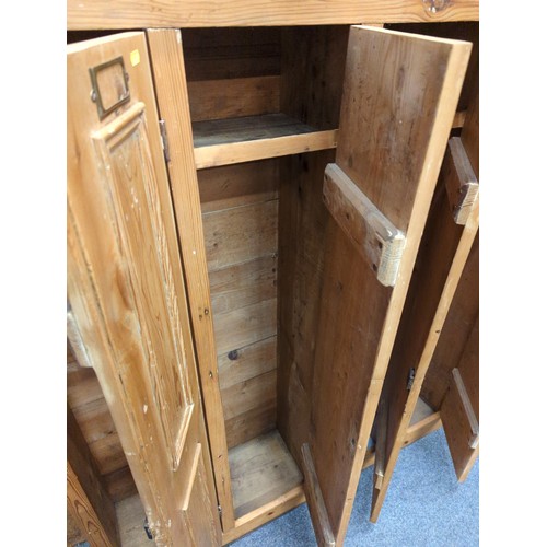 558 - Striped pine locker unit comprising of 7 locker/cupboards W229.5cm D32cm H155cm. Individual cupboard... 
