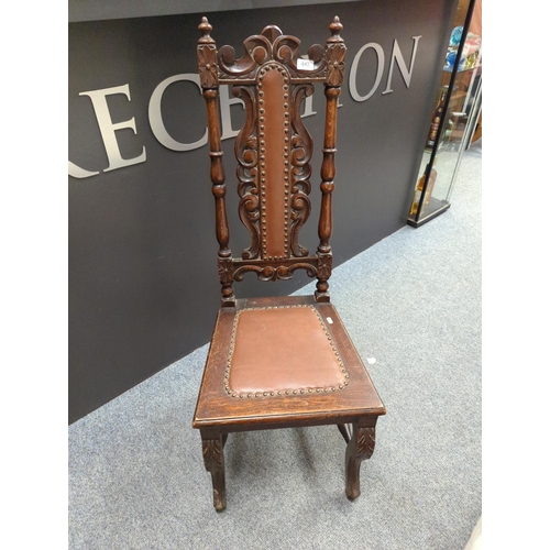 642 - Oak hall chair with carved back