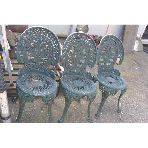 63 - 3 green cast aluminium garden chairs