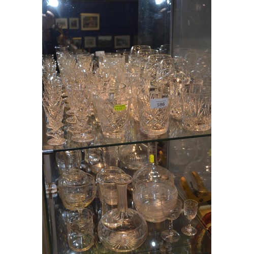 210 - 2 shelves of cut glass wine & other glasses plus etched glass decanters etc, approx 40 pieces in... 